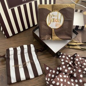 Henri Bendel gift box, gift bag, and satchel with tissue paper